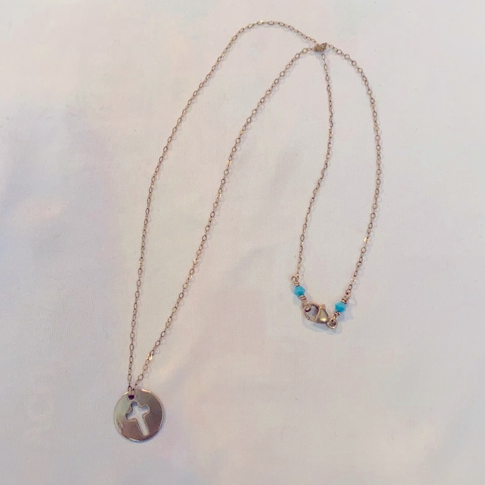 Gold cross necklace with turquoise stones accent